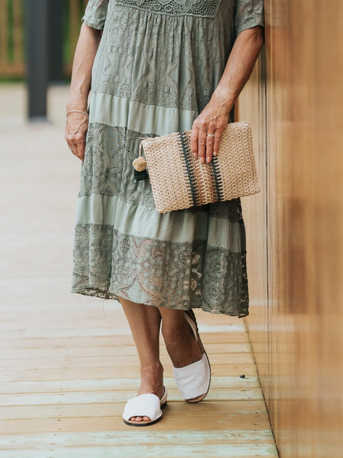 Pom Pom Stripe Woven Clutch Bag